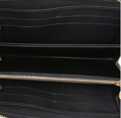 Portafogli Louis Vuitton Zippy in tela monogram cerata color crema con motivo