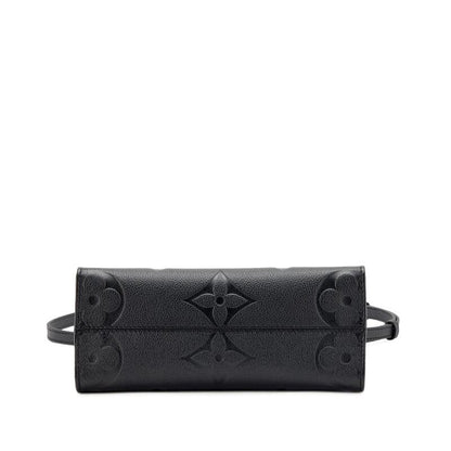 Louis Vuitton Black Giant Monogram Empreinte OnTheGo PM Gold Hardware, 2022